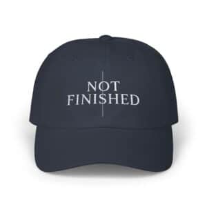 Not Finished Dad Cap embroidered green baseball hat with motivational text