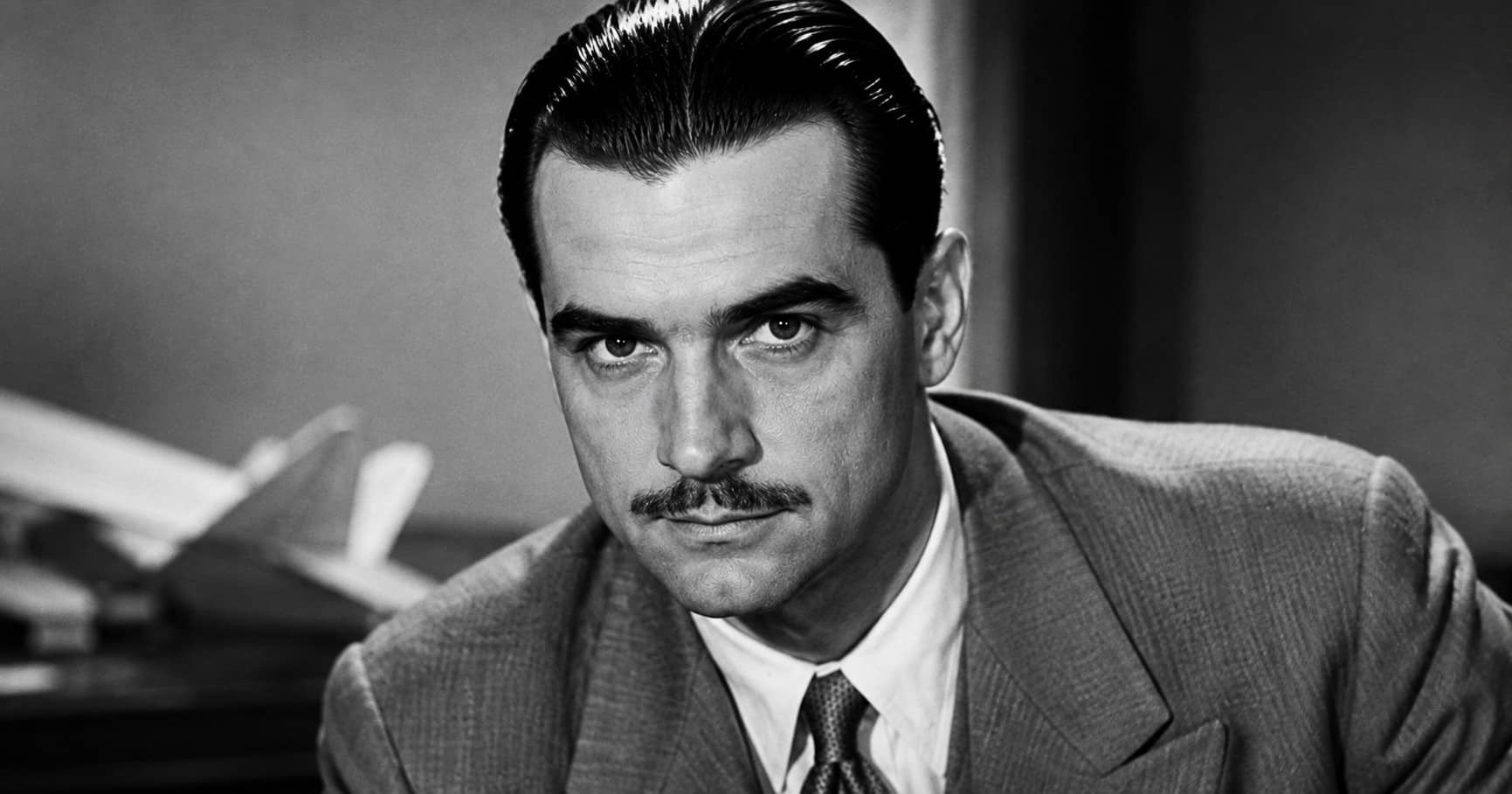 Howard Hughes true story showing the billionaire, aviation pioneer, filmmaker, wealth, isolation, and struggle for peace